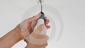Screwing in an electrical energy saving light bulb in a renovated room