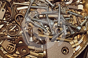 Screws background. heap of tapping screws. work tool. pile of fasteners. bolts and nuts. metal scrape