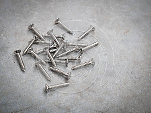 Screws on a cement background
