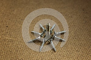 The screws in the form of a star. Closeup of screws on wood
