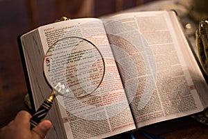 Scripture with gold praying hands