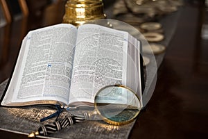 Scripture Reading with magnify glass photo