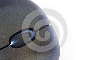 Scrolling wheel on a gray computer mouse. Close-up. Macro