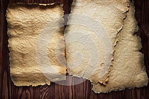 Scrolls of old paper on a wooden table. Antique background