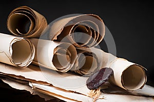 Scrolls of parchment on the background of old papers