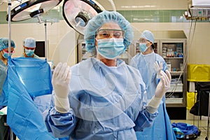 Scrub nurse gowned and gloved