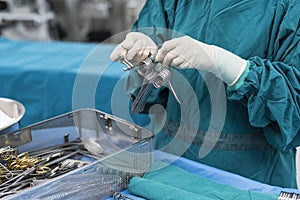 Scrub nurse prepare medical instruments