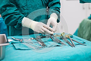 Scrub nurse prepare medical instruments for surgery