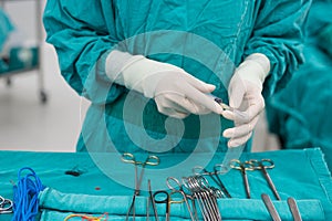 Scrub nurse prepare medical instruments for surgery