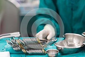 Scrub nurse prepare medical instruments for surgery
