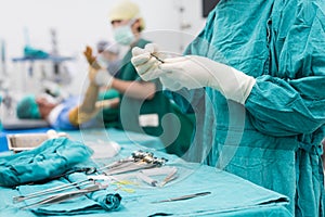 Scrub nurse prepare medical instruments surgery photo