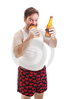 Scruffy Man Eats Sub Sandwich photo