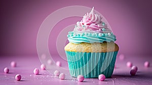 Scrumptious cupcake with yummy pink frosting and blue wrapper photo