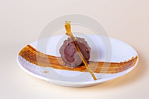 Scrumptious round chocolate cake pop isolated on white photo