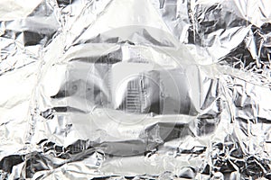 Scrunched shiny aluminium foil surface