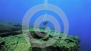 Scuba diver in amazing landscape photo