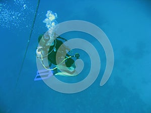 scuba diver Blowing bubbles underwater