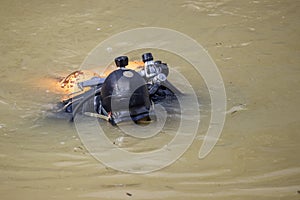 Scuba diver clean garbage from river