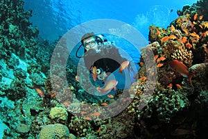 Scuba Diver explores Coral Reef photo