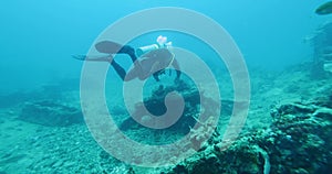 Scuba Diver Exploring Big Ship Wreck. The ship was Japanese and sunk during World War II