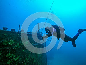 Scuba Diver Exploring A Large Shipwreck