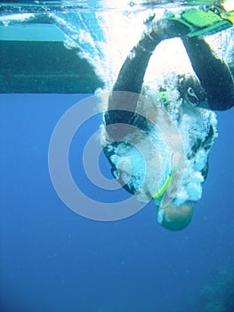 Scuba diver hitting water