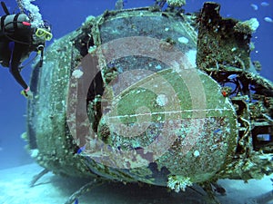 Scuba Diver Observes a USA made Huey Helicopter in Majuro Lagoon