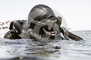 Scuba diver with re-breather