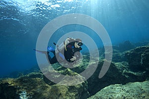 Scuba-Diver in shallow water photo
