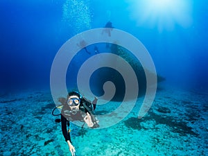 Scuba diver shows the OK sign in the blue, Aegean Sea in Greece photo