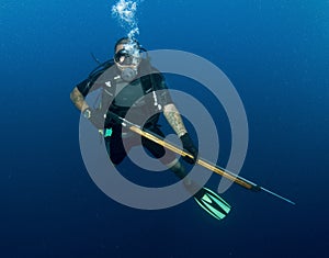 Scuba diver with spear gun