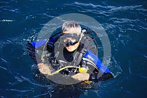 Scuba Diver surfaces
