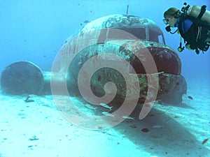 Scuba Diver Surveys a DC-3 in Majuro Lagoon, Marshall Islands