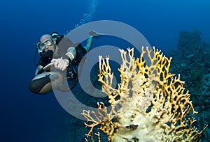 Scuba diver on underwater scooter