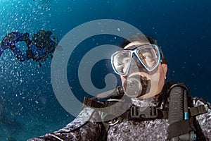 Scuba diver underwater selfie portrait in the ocean