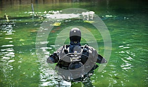 Scuba diver worker is over viewing underwater archaeology works. photo