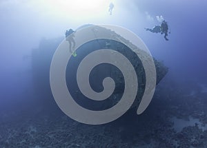Scuba divers exploring a shipwreck