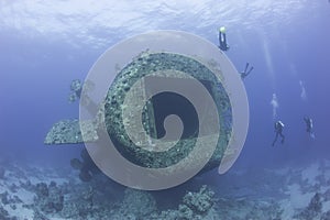 Scuba divers exploring a shipwreck