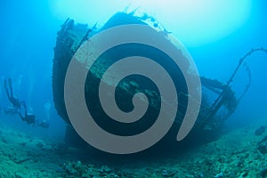 Scuba divers on a large shipwreck