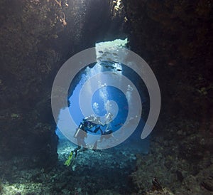 Scuba divers in an underwater cavern