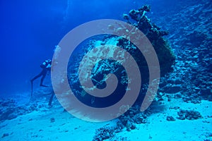 Scuba divers at underwater wreck