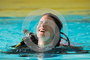 Scuba diving course pool teenager girl with instructor