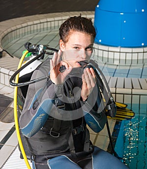 Scuba diving course pool teenager girl with instructor