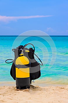 Scuba diving equipment on a beach