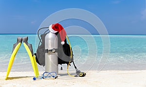 Scuba diving equipment with Santa Claus hat