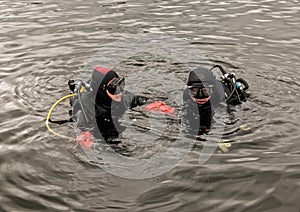 Scuba diving in a mountain lake, practicing techniques for emergency rescuers. immersion in cold water photo