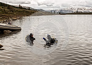 Scuba diving in a mountain lake, practicing techniques for emergency rescuers. immersion in cold water