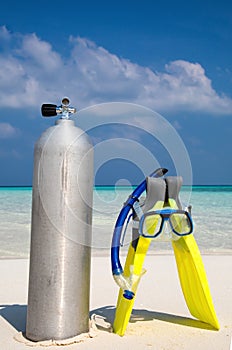 Scuba diving tank with Fins and mask on beach