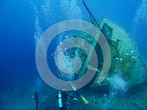 Scuba diving by wreck Cedar Pride in Aqaba, Jordan, Red Sea photo