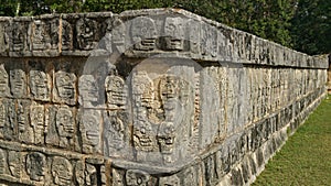 Scull carvings on a stone wall in the Yucatan